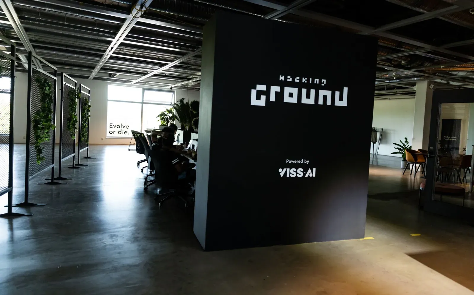The Hacking Ground wall in the venue, powered by VISS.AI