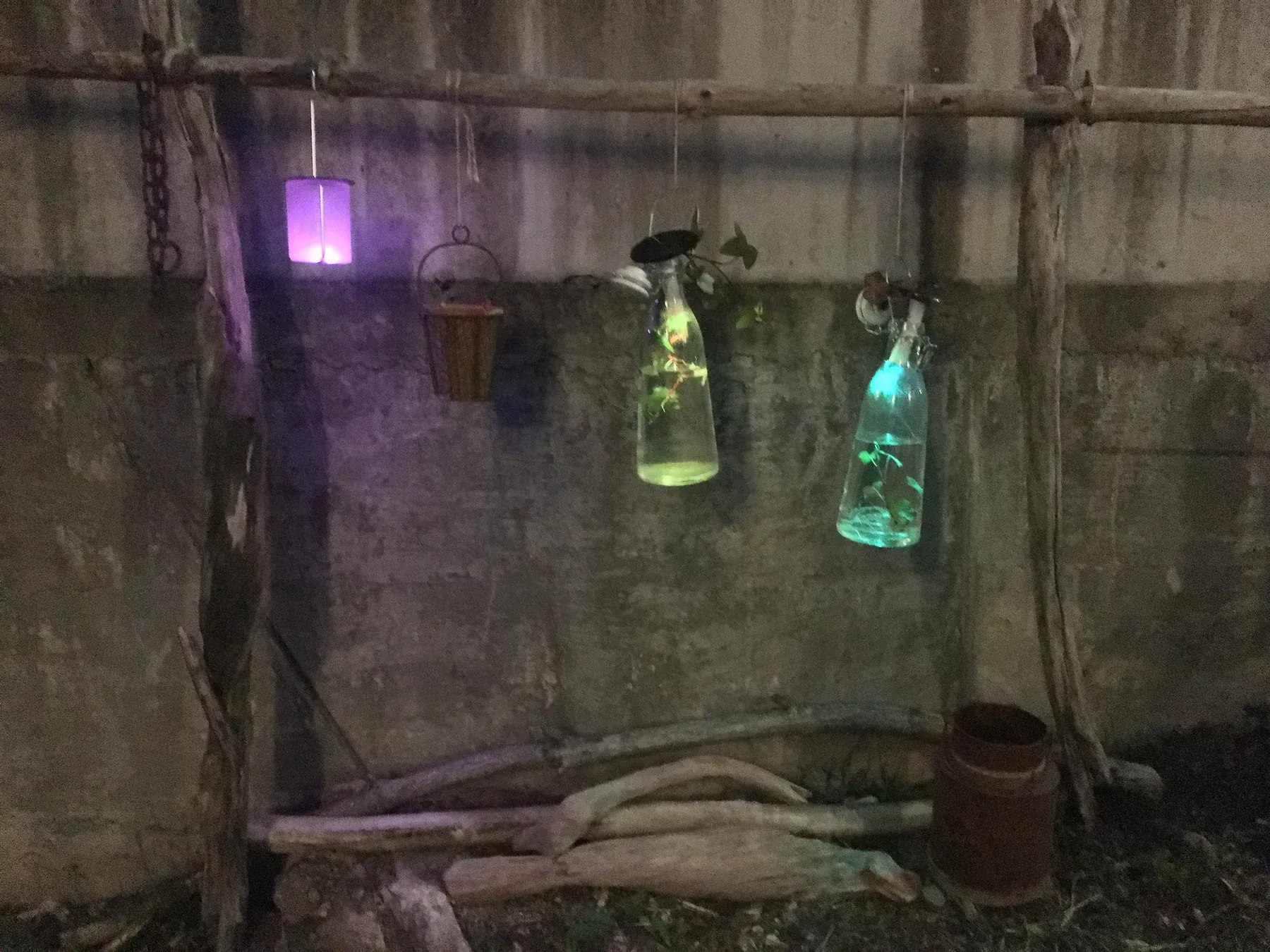 Solar lamps glowing inside glass bottles at night